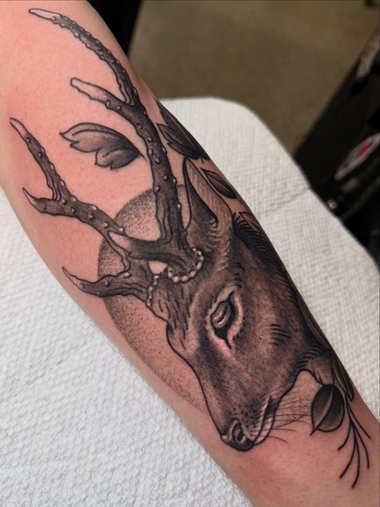 Black and white buck tattoo
