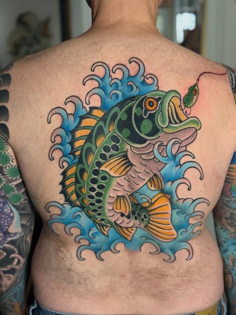 Colorful fish back tattoo