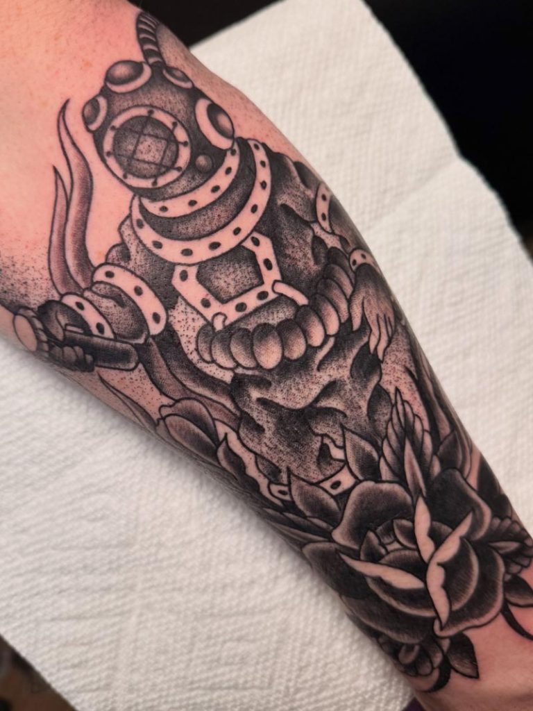 Black and white scuba diver tattoo
