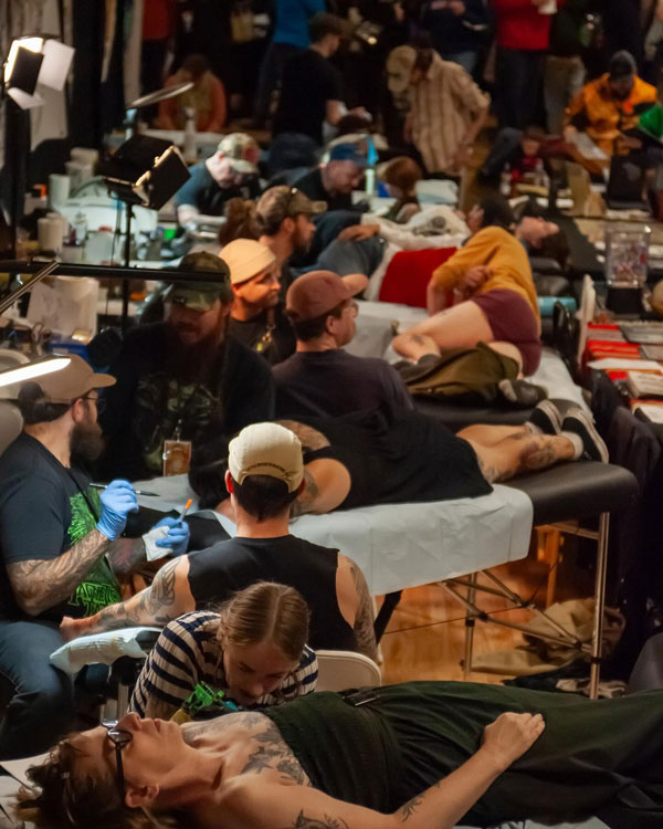 People getting tattooed at Rail City Tattoo Convention